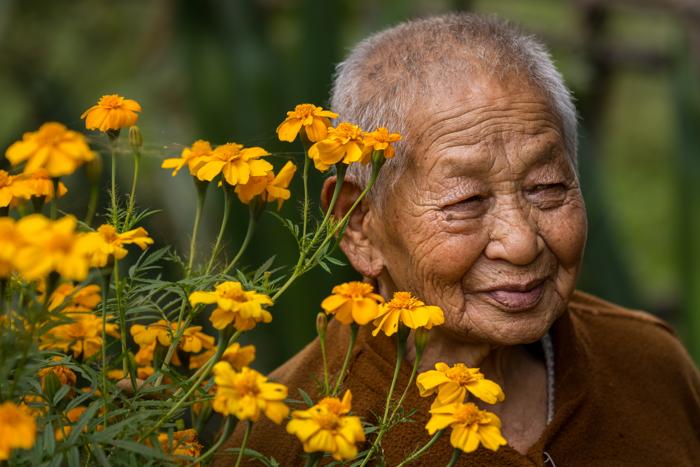 Bhutanese woman with marigolds